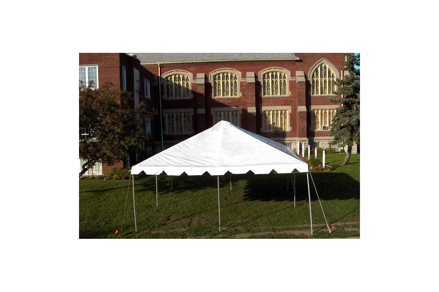 20x20 white frame party tent rental setup on grass for Winnipeg outdoor events