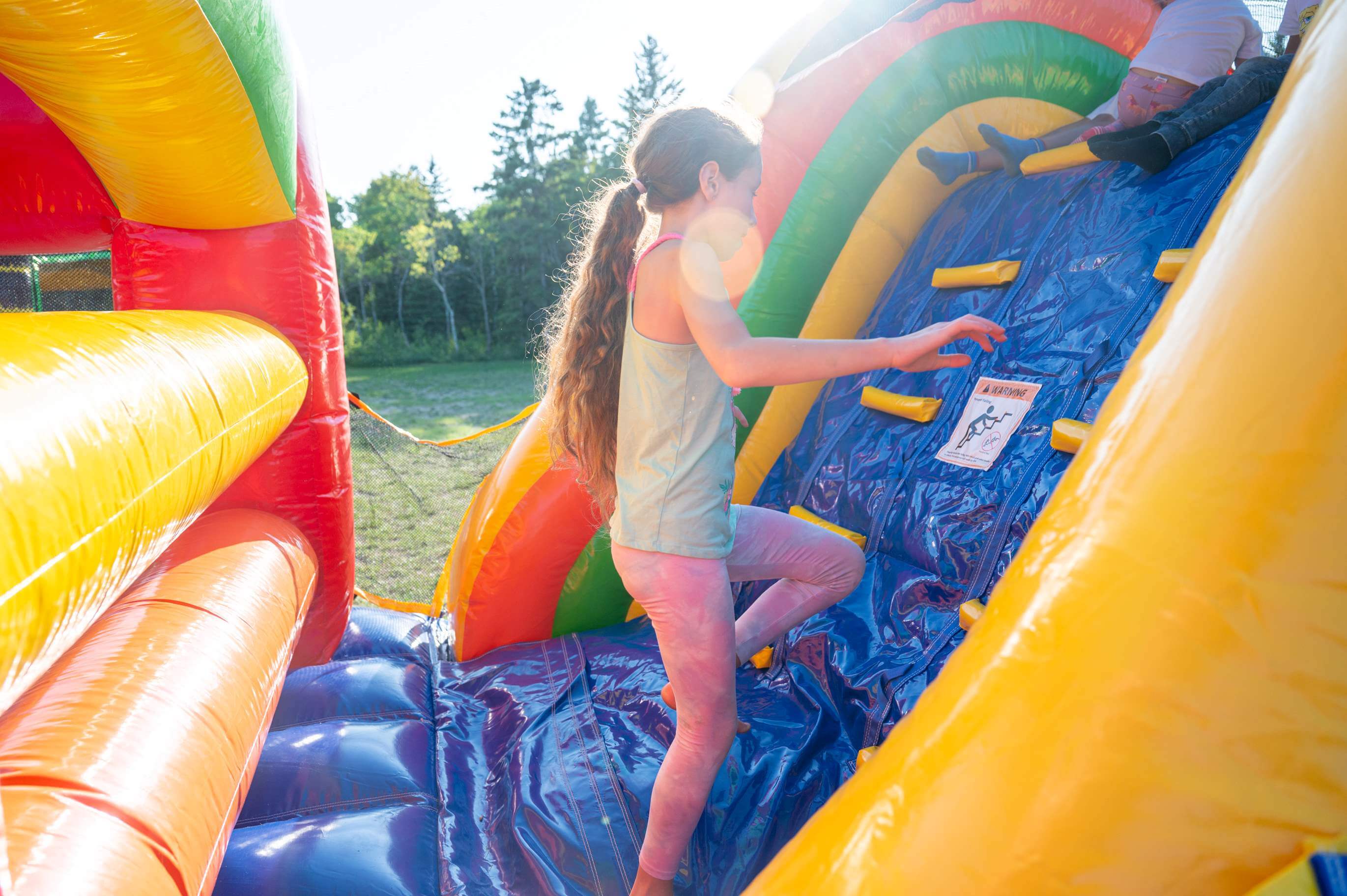 40 foot Rainbow Mega Obstacle Course by Jump Up Bouncers in Winnipeg Manitoba
