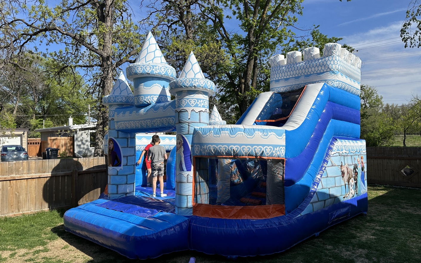 Frozen Ice inflatable bouncy castle with slide for kids events in Manitoba