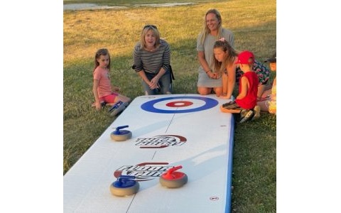 Indoor friendly inflatable curling game rental for team building and community events
