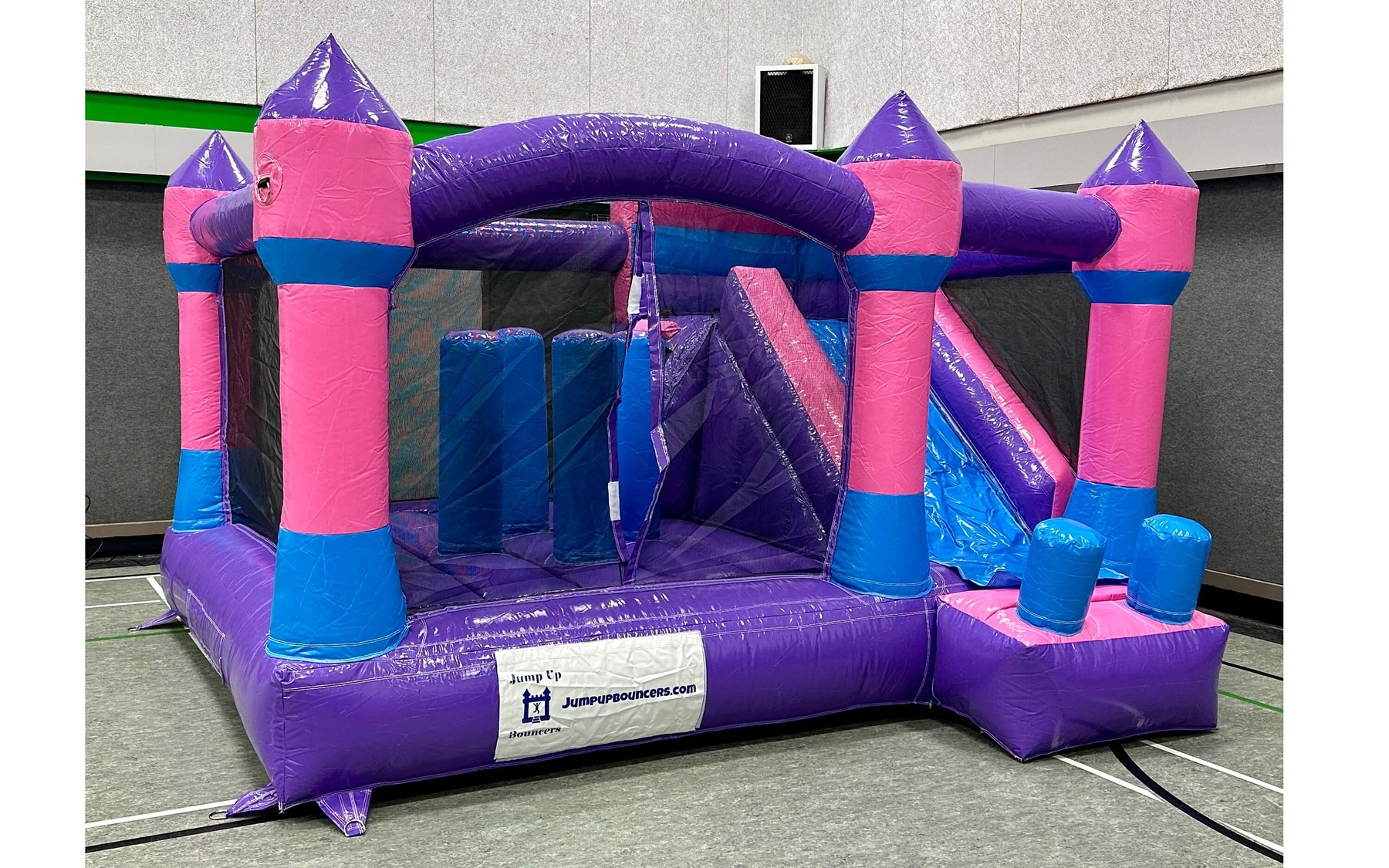 Jump and Slide inflatable bouncy castle pink and purple rental in Winnipeg Manitoba