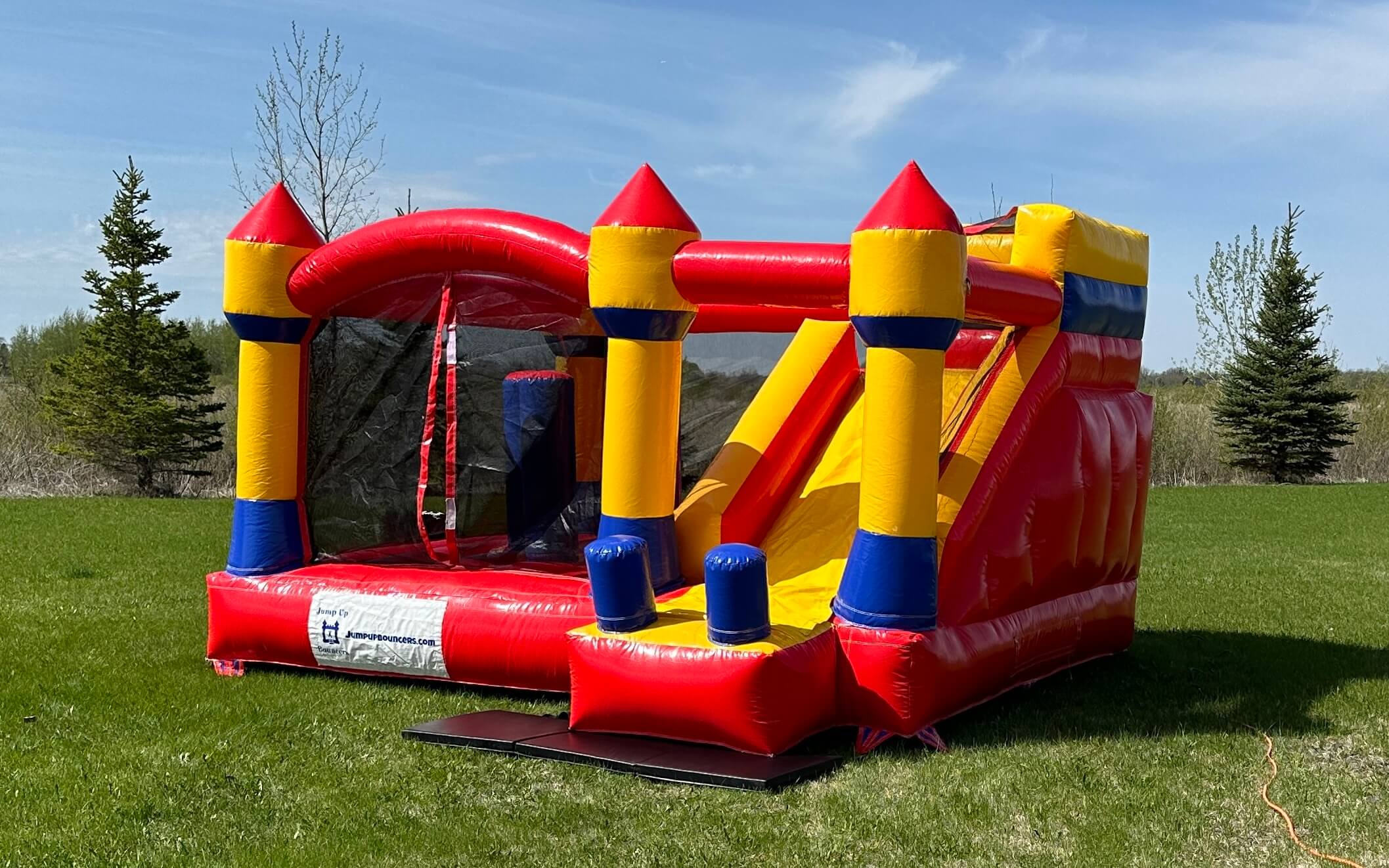 Jump and Slide inflatable bouncy castle with slide rental in Winnipeg Manitoba yellow and red