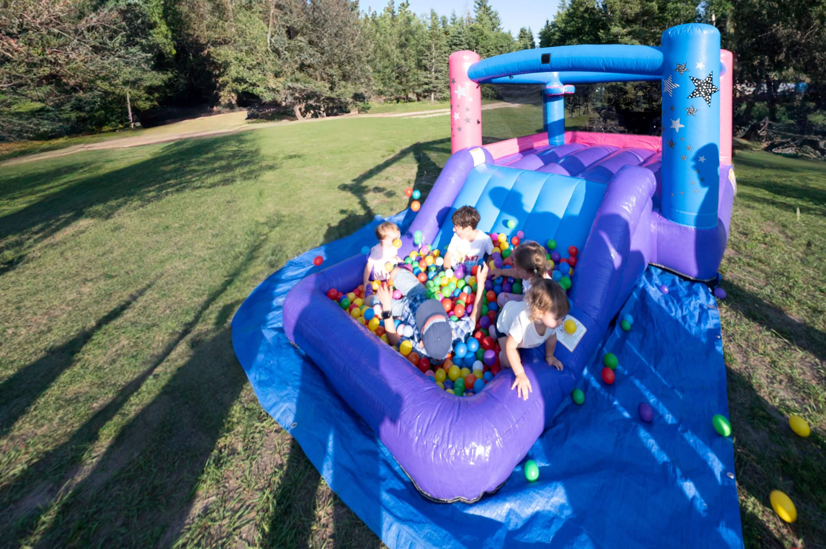 Compact bounce house with slide and splash area rental in Manitoba