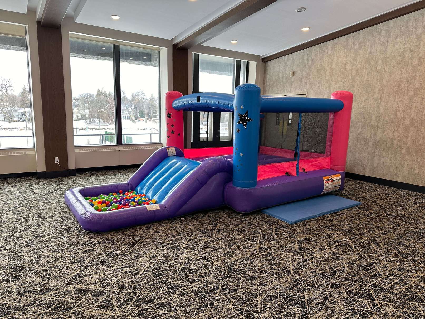 Little Star bouncer with slide for summer backyard parties in Winnipeg