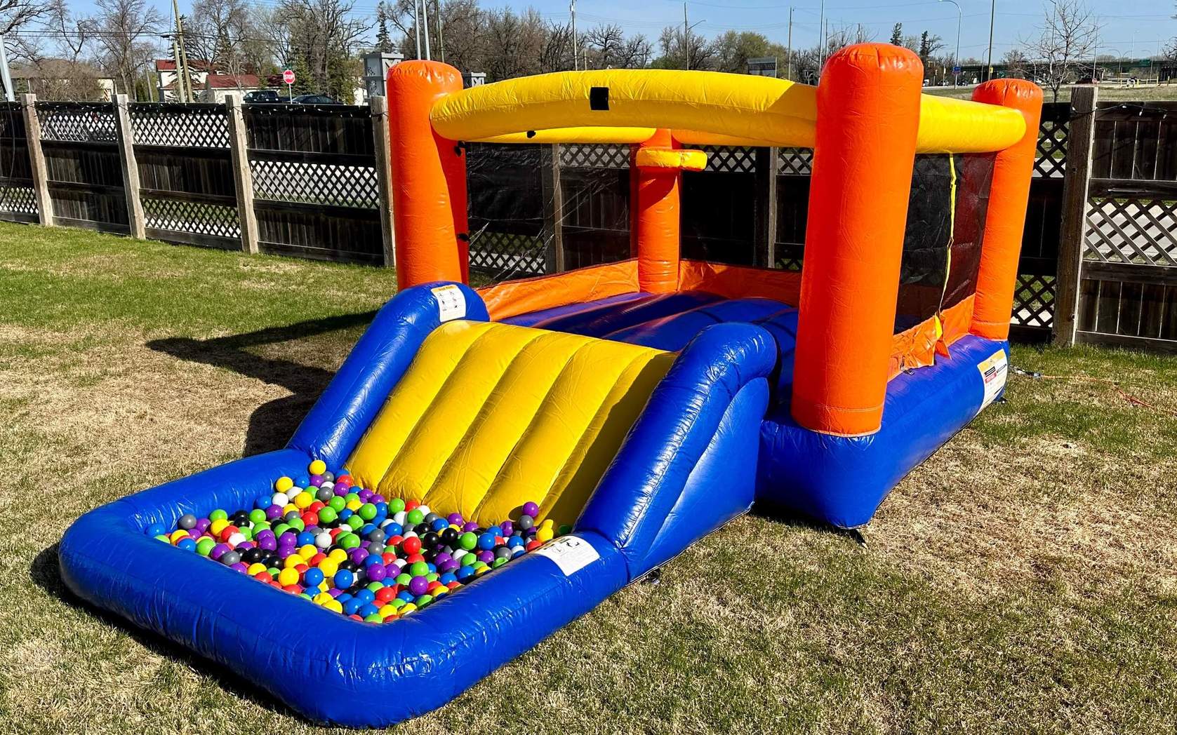 Orange Splash inflatable bouncer with slide and waterslide rental in Winnipeg Manitoba