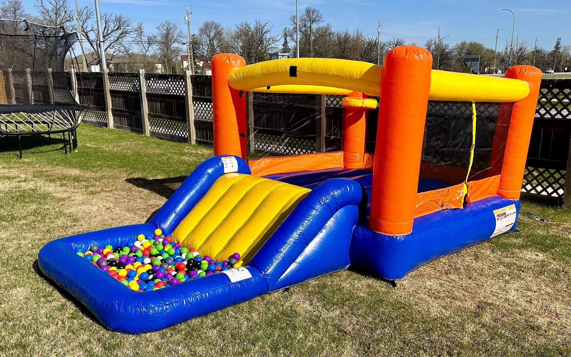 Orange Splash wet or dry bouncer with slide for kids parties in Winnipeg