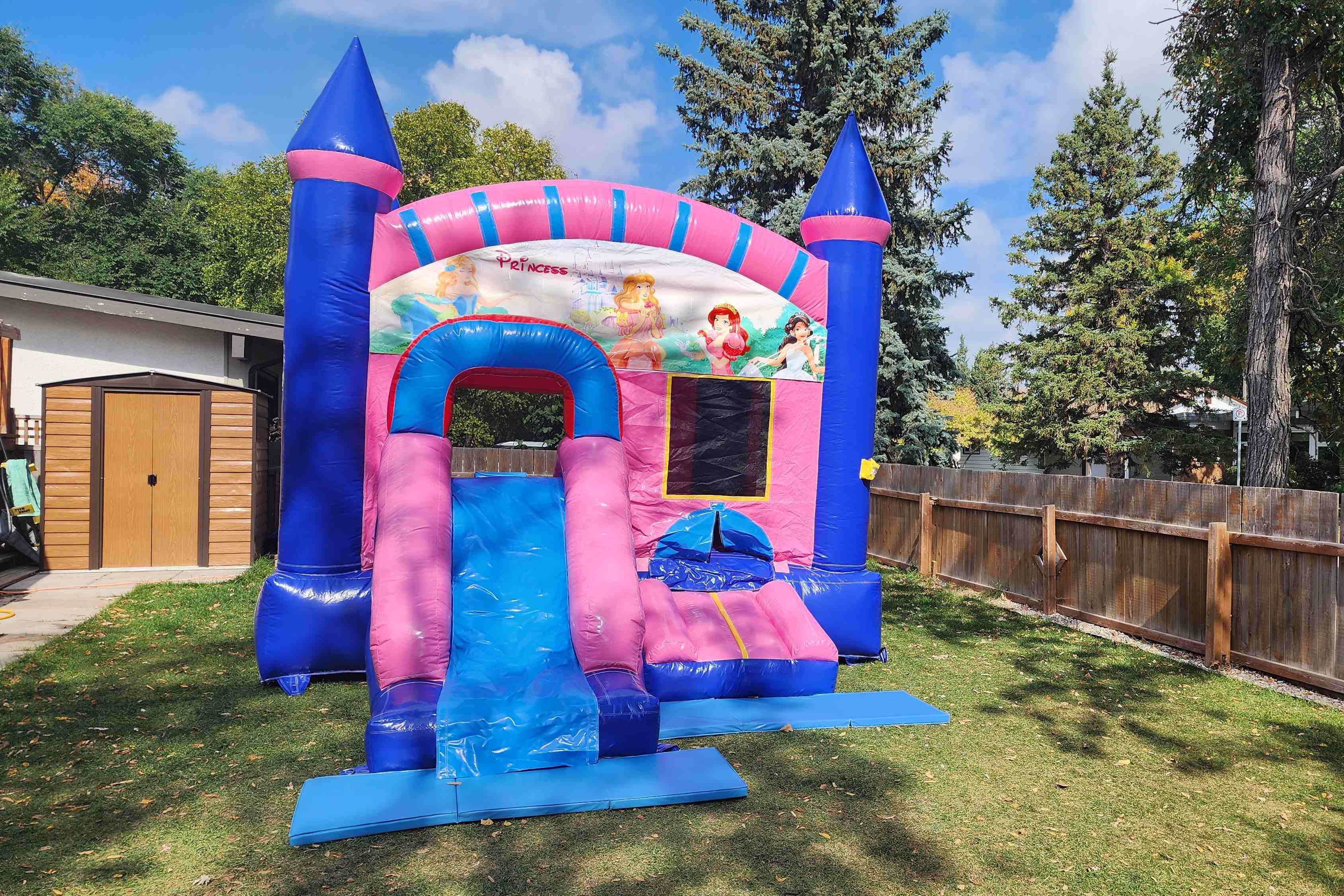Pink bouncy castle combo with slide for birthday parties in Winnipeg