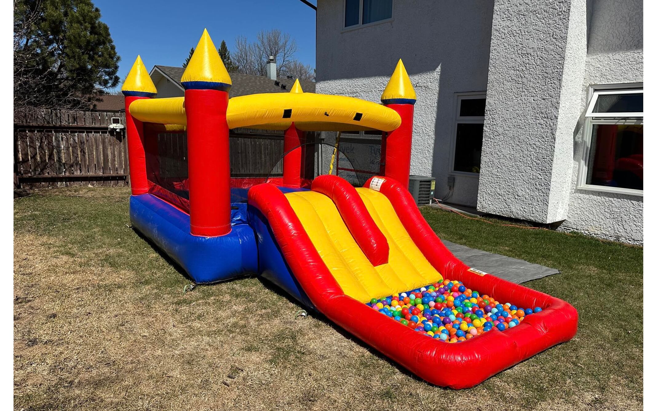 Red Castle inflatable bounce house with slide for kids parties