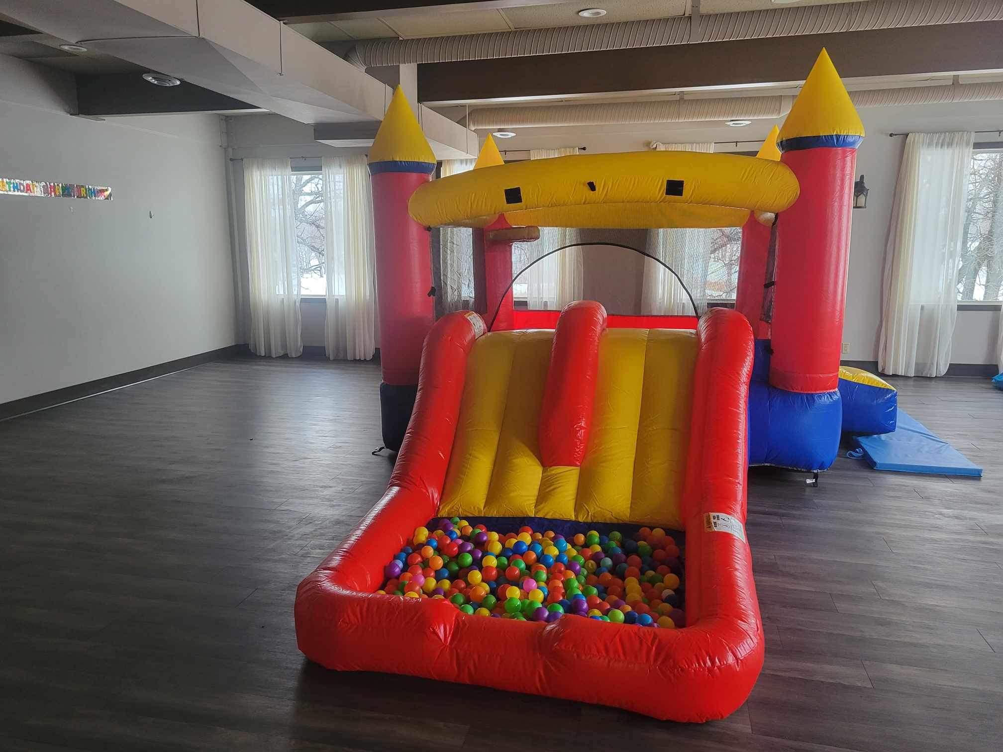 Red Castle inflatable combo with bounce area and slide