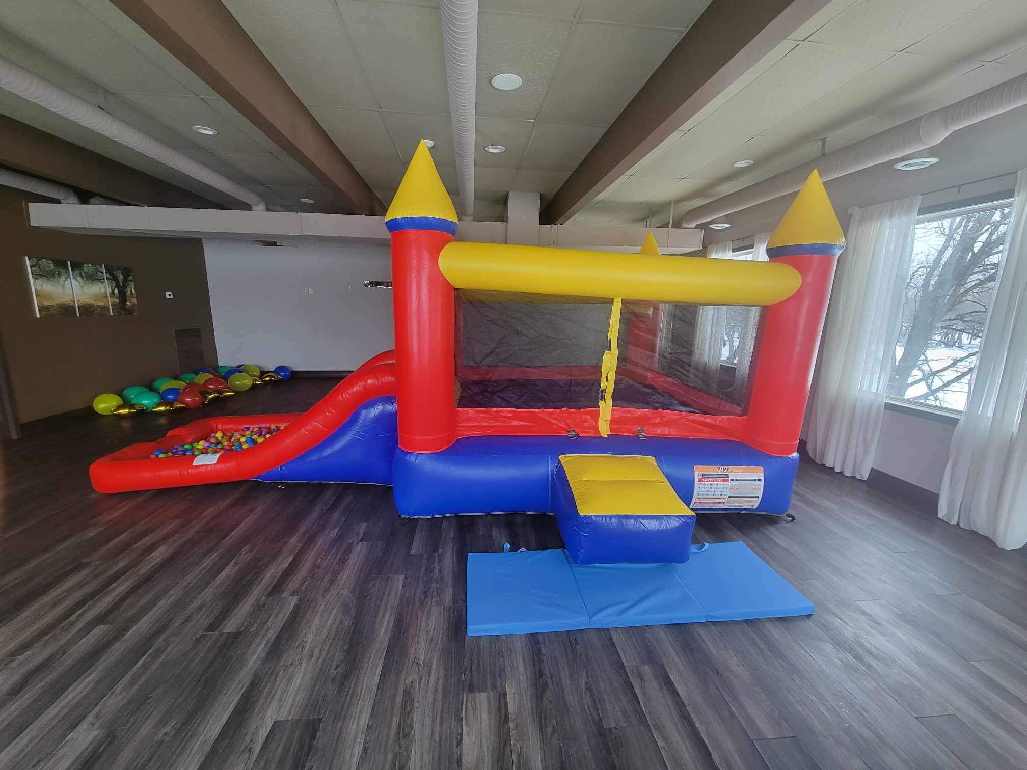 Children's red inflatable bounce house rental in Winnipeg