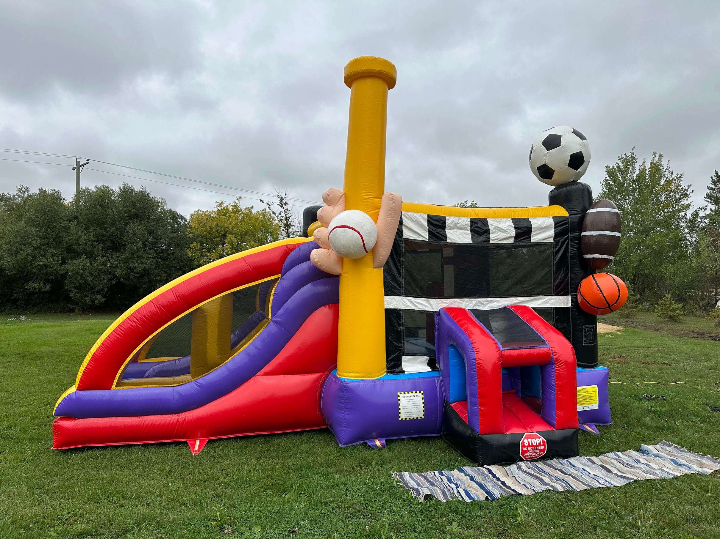Large sports bounce castle with basketball hoop and slide in Winnipeg Manitoba