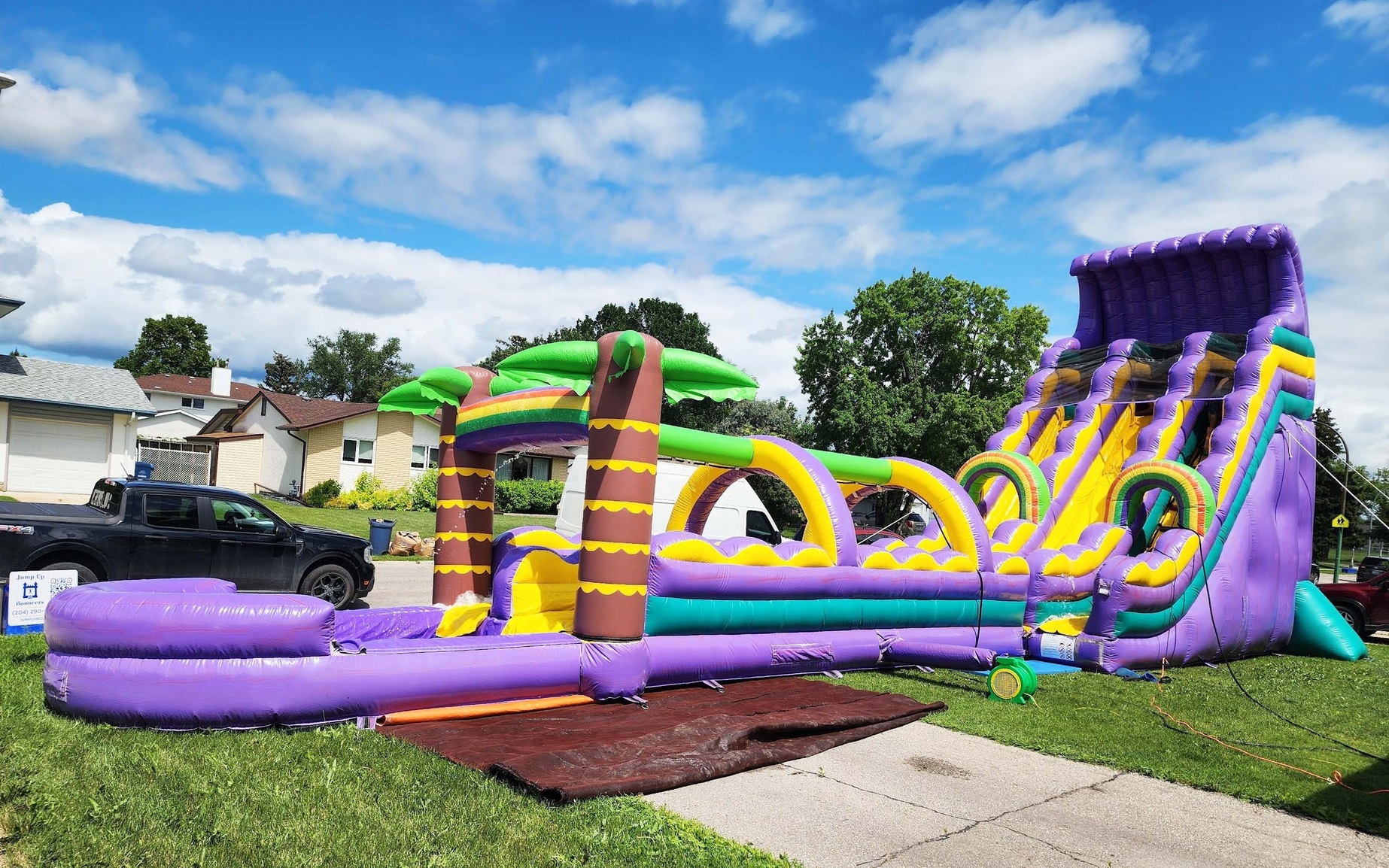 Tropical Dual Lane Waterslide with Slip and Slide inflatable rental Winnipeg Manitoba