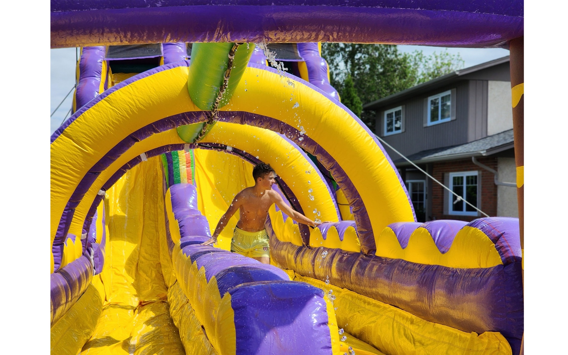 Jump Up Bouncers tropical dual lane waterslide rental for summer events and school fun days
