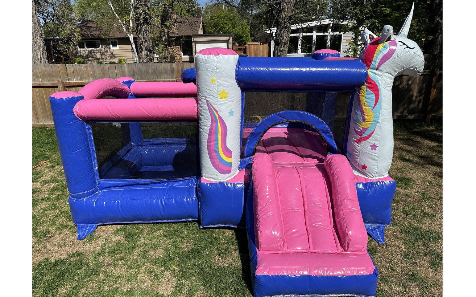 Toddler-friendly unicorn bouncy castle with enclosed safety netting