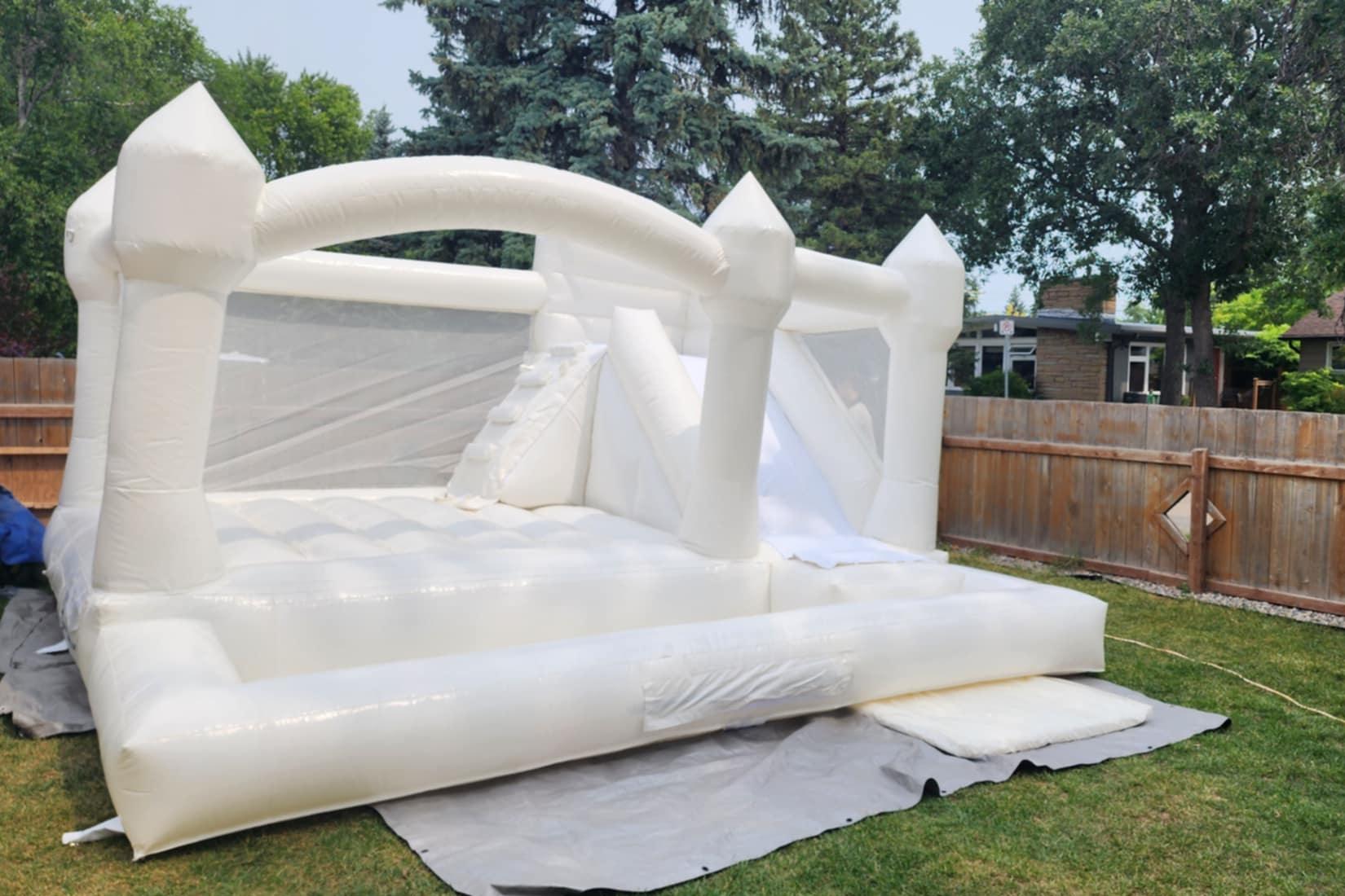 Elegant white inflatable bouncy castle for wedding photos and upscale events
