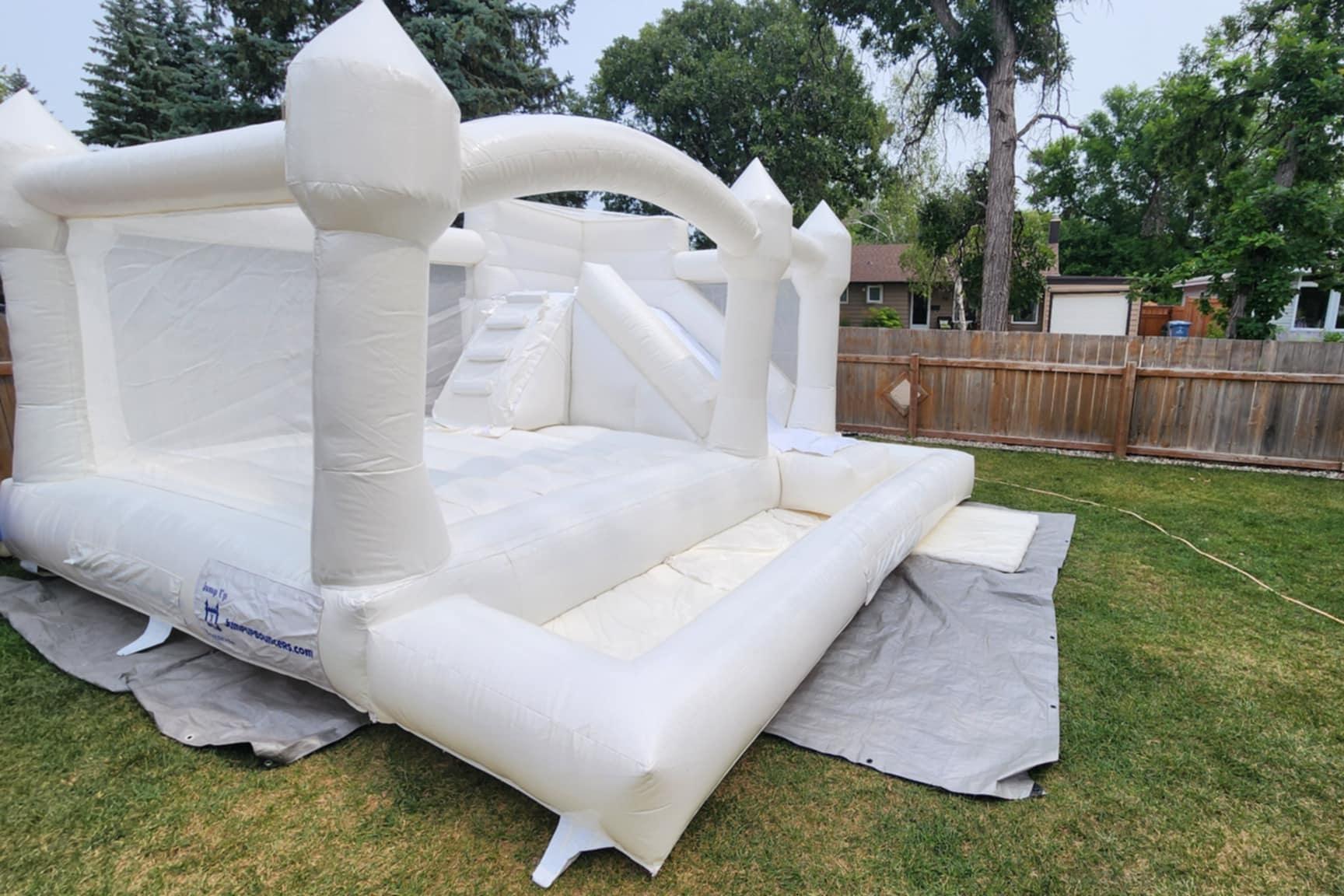 Modern all-white bounce house rental for socials bridal showers and baby showers