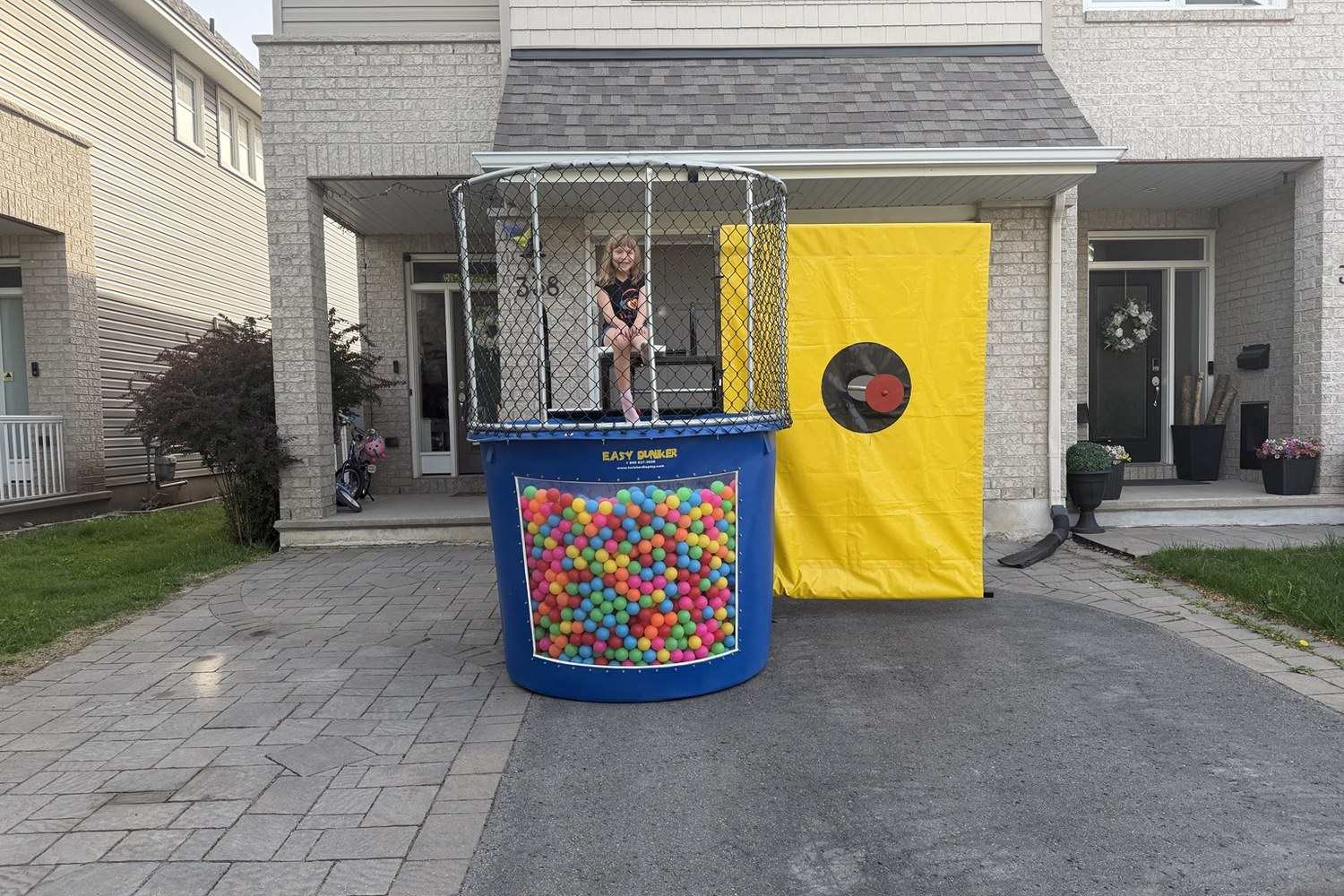 Dry dunk tank with up to 8000 pit balls for corporate events in Manitoba